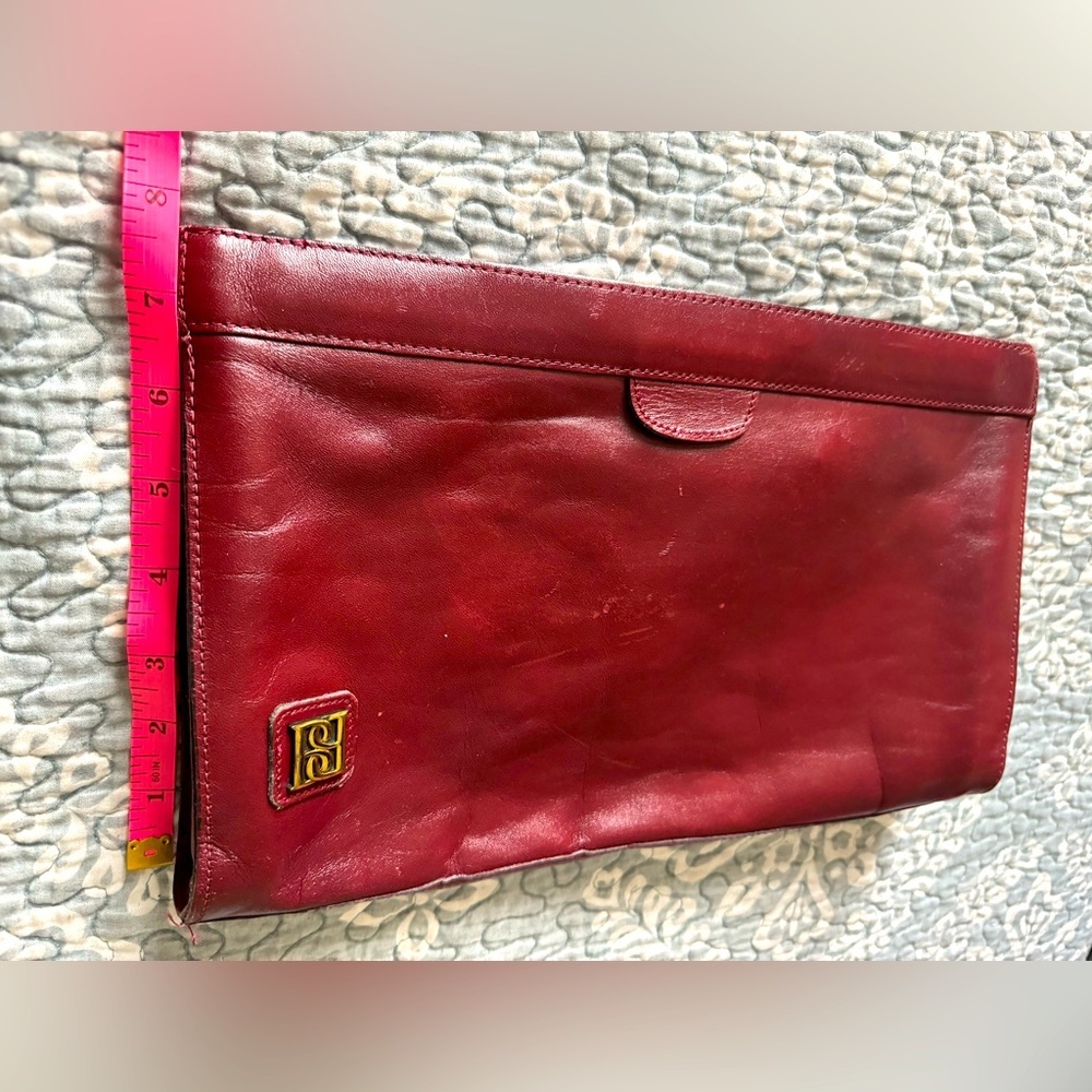 Real leather clutch, burgundy color, hard snap closure